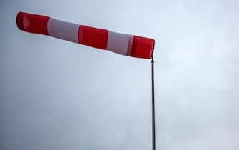 epa03977945 A windsock indicates strong cross-winds in Geraberg,†Germany, 05 December 2013. Storm front Xaver has reached the North Sea coast of Germany.  EPA/MICHAEL REICHEL