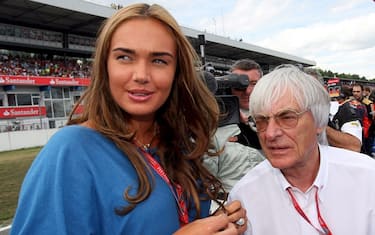 epa01419085 F1 boss British Bernie Ecclestone (R) and his daughter Tamara stand on the grid before the start of the the German Grand Prix at Hockenheim race track in Germany, 20 July 2008. Britain's Lewis Hamilton celebrated his second Formula One victory in succession as the McLaren-Mercedes driver overcame the disadvantage of a safety car to win the German Grand Prix at Hockenheim. Renaultâ  s Nelson Piquet Jr was a surprise second and Felipe Massa of Ferrari finished third behind Hamilton, whose fourth season win was the first for McLaren-Mercedes at Hockenheim in a decade.   ANSA-EPA / JENS BUETTNER / PAL
