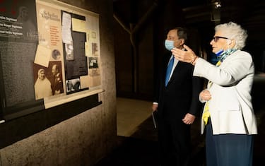 This handout photo provided by the Chigi Palace press office shows Italian Prime Minister Mario Draghi during a visit to the Shoah Memorial, near Milan Central Station, with Italian life senator Liliana Segre, survivor of Auschwitz, in Milan, Italy, 30 September 2021. The Memorial is located along track 21 from which, starting in 1943, the convoys with the Milanese Jews destined for the extermination camps left.
ANSA/ CHIGI PALACE PRESS OFFICE/ FILIPPO ATTILI
+++ ANSA PROVIDES ACCESS TO THIS HANDOUT PHOTO TO BE USED SOLELY TO ILLUSTRATE NEWS REPORTING OR COMMENTARY ON THE FACTS OR EVENTS DEPICTED IN THIS IMAGE; NO ARCHIVING; NO LICENSING +++