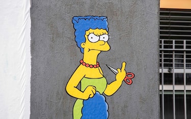 The Cut 2, the sequel, a mural created by the street artist AleXsandro Palombo shows Marge Simpson, a character in the animated sitcom 'The Simpsons,' shows her "middle finger" in solidarity with Mahsa Amini and in protest against the Iranian regime, in Milan, Italy, 11 October 2022. The mural was displayed in front of the Iranian consulate in Milan. Amini, a 22-year-old Iranian woman, was arrested in Tehran on 13 September 2022 by the morality police, a unit responsible for enforcing Iran's strict dress code for women. She fell into a coma while in police custody and was declared dead on 16 September 2022. 
ANSA/Andrea Fasani