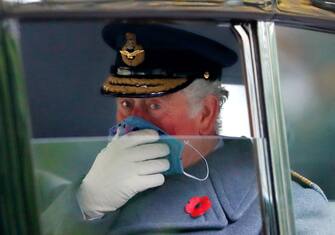 1284608450 LONDON, UNITED KINGDOM - NOVEMBER 08: (EMBARGOED FOR PUBLICATION IN UK NEWSPAPERS UNTIL 24 HOURS AFTER CREATE DATE AND TIME) Prince Charles, Prince of Wales seen wearing a face mask as he travels in his chauffeur driven Rolls Royce car after attending the National Service of Remembrance at The Cenotaph on November 8, 2020 in London, England. Remembrance Sunday services were substantially scaled back today due to the current restrictions on gatherings, intended to curb the spread of covid-19. (Photo by Max Mumby/Indigo/Getty Images)