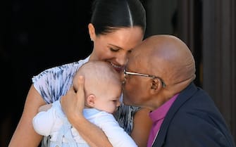 EMBARGOED TO 0001 TUESDAY MARCH 31 File photo dated 25/09/19 of baby Archie being kissed on the forehead by Archbishop Desmond Tutu while in the hands of his mother The Duchess of Sussex in Cape Town. On March 31, the Duke and Duchess of Sussex will be quitting as senior royals, when they will stop using their HRH styles and no longer be able to have Sussex Royal as their brand. The PA news agency looks back on the royal couple's highlights. (Toby Melville / IPA/Fotogramma, LONDON - 2020-03-31) p.s. la foto e' utilizzabile nel rispetto del contesto in cui e' stata scattata, e senza intento diffamatorio del decoro delle persone rappresentate