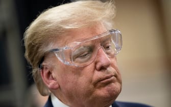 US President Donald Trump tours a Honeywell International Inc. factory producing N95 masks during his first trip since widespread COVID-19 related lockdowns went into effect May 5, 2020, in Phoenix, Arizona. (Photo by Brendan Smialowski / AFP) (Photo by BRENDAN SMIALOWSKI/AFP via Getty Images)