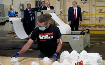 US President Donald Trump tours a Honeywell International Inc. factory producing N95 masks during his first trip since widespread COVID-19 related lockdowns went into effect May 5, 2020, in Phoenix, Arizona. (Photo by Brendan Smialowski / AFP) (Photo by BRENDAN SMIALOWSKI/AFP via Getty Images)