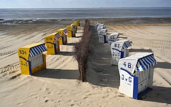 CUXHAVEN, GERMANY - MAY 06: Beach chairs stand ready for vacationers at Duhne beach during the coronavirus crisis on May 6, 2020 near Cuxhaven, Germany. German states that contain popular holiday destinations and that are economically dependant on tourism, including Lower Saxony, Mecklenburg-Western Pomerania, Schleswig-Holstein and Bavaria, have announced an easing of lockdown measures in order to let hotels, restaurants and beaches reopen for visitors in coming weeks. (Photo by Stuart Franklin/Getty Images)