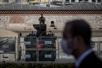 ISTANBUL, TURKEY - APRIL 23: A Turkish Special Forces soldier stands guard at Taksim Square on the National Sovereignty and Childrenâ  s Day holiday on the first day of a four-day lockdown due to the ongoing coronavirus pandemic on April 23, 2020 in Istanbul, Turkey. During normal celebrations people attend memorial services, concerts, street parades, school activities and cultural events. However, this year due to the spread of the COVID-19 virus and an enforced lockdown many districts cancelled events and organized buses with bands playing live on the rooftop or vans playing music to tour neighborhoods to celebrate the holiday. As of April 23, according to the Health Ministry, Turkey has 2,491 Coronavirus related deaths and confirmed cases have risen to 101,790. Despite the rising numbers Turkey has avoided a full lockdown and continues to implement short lockdowns and constant revisions of current restrictions. The interior ministry has extended restrictions on travel between 31 cities for another 15 days, a curfew continues to be in place for anyone over the age of 65 and under 20, schools, cafes, bars and non-essential businesses remain closed.  (Photo by Chris McGrath/Getty Images)