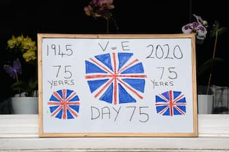 SALTBURN BY THE SEA, UNITED KINGDOM - MAY 08: Home made posters are displayed in windows during celebrations for the 75th anniversary of VE Day on May 08, 2020 in Saltburn By The Sea, United Kingdom. The UK commemorates the 75th Anniversary of Victory in Europe Day (VE Day) with a pared-back rota of events due to the coronavirus lockdown. On May 8th, 1945 the Allied Forces of World War II celebrated the formal acceptance of surrender of Nazi Germany. (Photo by Ian Forsyth/Getty Images)