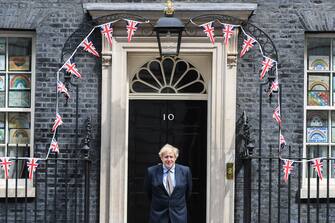 1212189109 LONDON, ENGLAND - MAY 08: British Prime Minister Boris Johnson is seen outside Number 10 Downing Street on May 8, 2020 in London, United Kingdom.The UK commemorates the 75th Anniversary of Victory in Europe Day (VE Day) with a pared-back rota of events due to the coronavirus lockdown. On May 8th, 1945 the Allied Forces of World War II celebrated the formal acceptance of surrender of Nazi Germany. (Photo by Peter Summers/Getty Images)