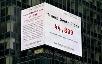 1223647531 NEW YORK, NEW YORK - MAY 08: A Trump Death Clock which calculates the portion of U.S. COVID-19 deaths caused by President Trump’s delayed response to the coronavirus pandemic was unveiled by Eugene Jarecki in Times Square during the coronavirus pandemic on May 08, 2020 in New York City. COVID-19 has spread to most countries around the world, claiming over 271,000 lives and infecting nearly 4 million people. (Photo by Dia Dipasupil/Getty Images)
