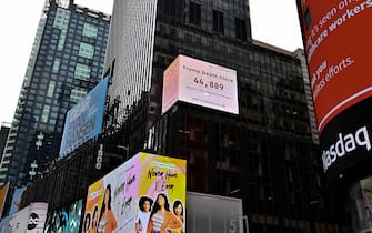 1223647543 NEW YORK, NEW YORK - MAY 08: A Trump Death Clock which calculates the portion of U.S. COVID-19 deaths caused by President Trump’s delayed response to the coronavirus pandemic was unveiled by Eugene Jarecki in Times Square during the coronavirus pandemic on May 08, 2020 in New York City. COVID-19 has spread to most countries around the world, claiming over 271,000 lives and infecting nearly 4 million people. (Photo by Dia Dipasupil/Getty Images)