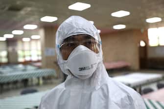SEOUL, SOUTH KOREA - MAY 11: A disinfection professional wearing protective clothing spray anti-septic solution at cafeteria to prevent the spread of the coronavirus (COVID-19) ahead of school re-opening on May 11, 2020 in Seoul, South Korea. South Korea's education ministry announced plans to re-open schools starting from May 13, more than two months after schools were closed in a precautionary measure against the coronavirus. Coronavirus cases linked to clubs and bars in Seoul's multicultural district of Itaewon have jumped to 54, an official said Sunday, as South Korea struggles to stop the cluster infection from spreading further. According to the Korea Center for Disease Control and Prevention, 35 new cases were reported. The total number of infections in the nation tallies at 10,909. (Photo by Chung Sung-Jun/Getty Images)