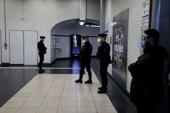 Policemen control commuters at a metro station in Paris, on May 11, 2020, as the lockdown introduced two months ago to fight the spread of the Covid-19 disease caused by the novel coronavirus starts to ease. (Photo by THOMAS COEX / AFP) (Photo by THOMAS COEX/AFP via Getty Images)