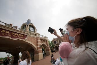 SHANGHAI, CHINA - MAY 11: Tourists visit Shanghai Disneyland after its reopening on May 11, 2020 in Shanghai, China. Shanghai Disneyland has reopened its gates following months of shutdown, offering a potential model for other mass entertainment venues around the world to open for business during the pandemic. (Photo by Hu Chengwei/Getty Images)