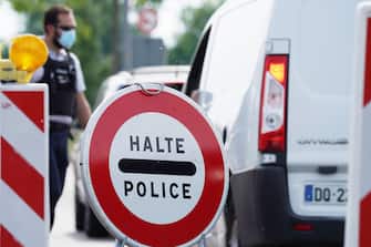 RASTATT, GERMANY - MAY 08: French border police officers stop cars at a checkpoint of the Pont de l'Europe Kehl  road to Strasbourg at the German-French border during the coronavirus crisis on May 8, 2020 in Kehl, Germany. The rates of new infections in both Germany and France, as in much of the European Union, have fallen dramatically over recent weeks, allowing governments to ease lockdown measures and strengthening demands by both business leaders and local communities to reopen international borders. In Germany so far Interior Minister Horst Seehofer is resisting a fast-paced lifting of border closures. (Photo by Thomas Niedermueller/Getty Images)