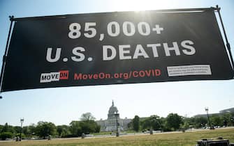 MoveOn.org stages a protest against the handling of the COVID-19 coronavirus pandemic by US President Donald Trump near the US Capitol in Washington, DC, May 13, 2020. (Photo by SAUL LOEB / AFP) (Photo by SAUL LOEB/AFP via Getty Images)