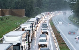 epa08418767 (FILE) - Trucks queue on the A93 motorway in the direction of Austria near Oberaudorf, Bavaria, Germany, 29 July 2019 (reissued 13 May 2020). Media reports state on 13 May 2020 that Germany is planning to partially ease border controls as early as 16 May 2020, following a decision of the Cabinet. At the same time, Austria is planning to reopen the border with Germany as early as 15 June, media added.  EPA/LUKAS BARTH-TUTTAS *** Local Caption *** 55368939