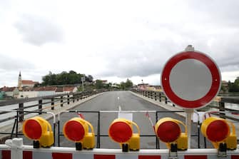 BAD FUESSING, GERMANY - MAY 14: A temporarily closed border crossings point between Bavaria/Germany and Austria is pictured at Kirchdorf am Inn near Bad Fuessing during the novel coronavirus crisis on May 14, 2020 near Bad Fuessing, Germany. Germany has announced a timetable for relaxing border restrictions that have been in effect since March as part of measures meant stem the spread of the virus. The timetable includes fully opening the border to Luxembourg starting May 16 and the borders to Austria, France and Switzerland by June 15. Until then every car will no longer be checked as is currently the practice, where only drivers with an adequate reason, such as commuting to work, are allowed to cross. Commercial and tourism interests have been pleading for a reopening of the borders. (Photo by Alexander Hassenstein/Getty Images)