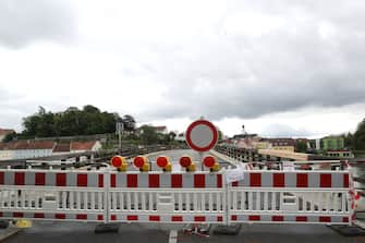 BAD FUESSING, GERMANY - MAY 14: A temporarily closed border crossings point between Bavaria/Germany and Austria is pictured at Kirchdorf am Inn near Bad Fuessing during the novel coronavirus crisis on May 14, 2020 near Bad Fuessing, Germany. Germany has announced a timetable for relaxing border restrictions that have been in effect since March as part of measures meant stem the spread of the virus. The timetable includes fully opening the border to Luxembourg starting May 16 and the borders to Austria, France and Switzerland by June 15. Until then every car will no longer be checked as is currently the practice, where only drivers with an adequate reason, such as commuting to work, are allowed to cross. Commercial and tourism interests have been pleading for a reopening of the borders. (Photo by Alexander Hassenstein/Getty Images)