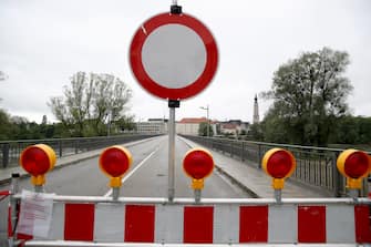 BAD FUESSING, GERMANY - MAY 14: A temporarily closed border crossings point between Bavaria/Germany and Austria is pictured at Simbach am Inn near Bad Fuessing during the novel coronavirus crisis on May 14, 2020 near Bad Fuessing, Germany. Germany has announced a timetable for relaxing border restrictions that have been in effect since March as part of measures meant stem the spread of the virus. The timetable includes fully opening the border to Luxembourg starting May 16 and the borders to Austria, France and Switzerland by June 15. Until then every car will no longer be checked as is currently the practice, where only drivers with an adequate reason, such as commuting to work, are allowed to cross. Commercial and tourism interests have been pleading for a reopening of the borders. (Photo by Alexander Hassenstein/Getty Images)