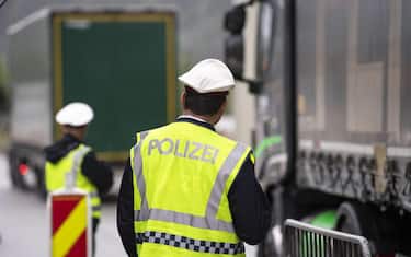 epa08418764 (FILE) - A police checkpoint slows down trucks on the A12 motorway near Ebbs, Austria, 29 July 2019 (reissued 13 May 2020). Media reports state on 13 May 2020 that Germany is planning to partially ease border controls as early as 16 May 2020, following a decision of the Cabinet. At the same time, Austria is planning to reopen the border with Germany as early as 15 June, media added. EPA/LUKAS BARTH-TUTTAS *** Local Caption *** 55368926