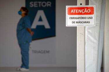 A nurse stands at the entrance of the new field hospital Parque dos Atletas -built for the treatment of the new COVID-19 coronavirus patients- in Rio de Janeiro, Brazil, on May 11, 2020. - Brazil, the hardest-hit Latin American country in the coronavirus pandemic, has surpassed 10,000 deaths, according to figures released last weekend by the Ministry of Health. (Photo by Mauro Pimentel / AFP) (Photo by MAURO PIMENTEL/AFP via Getty Images)