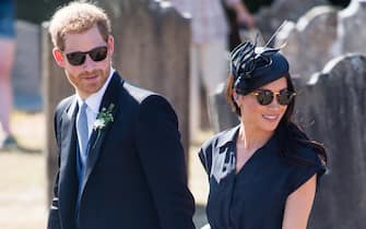FRENSHAM, UNITED KINGDOM - AUGUST 04:  Prince Harry, Duke of Sussex and Meghan, Duchess of Sussex attend the wedding of Charlie Van Straubenzee on August 4, 2018 in Frensham, United Kingdom. Prince Harry attended the same prep school as Charlie van Straubenzee and have been good friends ever since.  (Photo by Samir Hussein/Samir Hussein/WireImage)