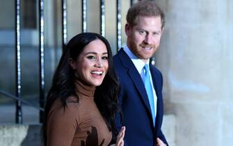 1192408411 LONDON, UNITED KINGDOM - JANUARY 07: Prince Harry, Duke of Sussex and Meghan, Duchess of Sussex react after their visit to Canada House in thanks for the warm Canadian hospitality and support they received during their recent stay in Canada, on January 7, 2020 in London, England. (Photo by DANIEL LEAL-OLIVAS - WPA Pool/Getty Images)