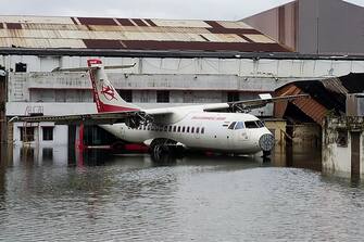 TOPSHOT - An aircraft is parked at the flooded Netaji Subhas Chandra Bose International Airport after the landfall of cyclone Amphan in Kolkata on May 21, 2020. - The most powerful cyclone to hit Bangladesh and eastern India in more than 20 years tore down homes, carried cars down flooded streets and claimed the lives of more than a dozen people. (Photo by - / AFP) (Photo by -/AFP via Getty Images)