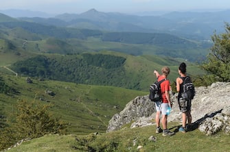 Mountain hikers enjoy the view from the top of the Mondarrain Mount near Itxassou, southwestern France, on May 21, 2020 as France eases lockdown measures taken to curb the spread of the COVID-19 (the novel coronavirus). (Photo by GAIZKA IROZ / AFP)