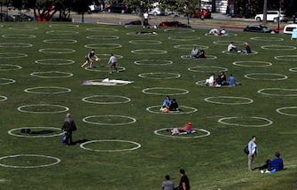 SAN FRANCISCO, CALIFORNIA - MAY 20: People sit in social distancing circles at Dolores Park on May 20, 2020 in San Francisco, California. The move follows similar moves by other parks in cities around the world in an effort to get back to some semblance of normalcy.  (Photo by Justin Sullivan/Getty Images)