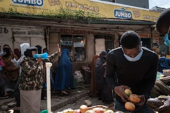 Police officers request all street vendors to close and leave to curb the spread of COVID-19 coronavirus as they emphasise the menace of the COVID-19 coronavirus in Eastleigh, a predominantly Muslim Somali neighbourhood, in Nairobi, Kenya, on April 24, 2020. (Photo by Yasuyoshi CHIBA / AFP) (Photo by YASUYOSHI CHIBA/AFP via Getty Images)