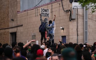 MINNEAPOLIS, MN - MAY 26: Protesters demonstrate against the death of George Floyd outside the 3rd Precinct Police Precinct on May 26, 2020 in Minneapolis, Minnesota. Four Minneapolis police officers have been fired after a video taken by a bystander was posted on social media showing Floyd's neck being pinned to the ground by an officer as he repeatedly said, "I can’t breathe". Floyd was later pronounced dead while in police custody after being transported to Hennepin County Medical Center. (Photo by Stephen Maturen/Getty Images)