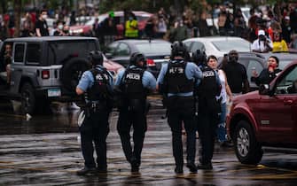 MINNEAPOLIS, MN - MAY 26: Police dressed in tactical gear attempt to disperse crowds gathered to protest the death of George Floyd outside the 3rd Precinct Police Station on May 26, 2020 in Minneapolis, Minnesota. Four Minneapolis police officers have been fired after a video taken by a bystander was posted on social media showing Floyd's neck being pinned to the ground by an officer as he repeatedly said, "I can’t breathe". Floyd was later pronounced dead while in police custody after being transported to Hennepin County Medical Center. (Photo by Stephen Maturen/Getty Images)