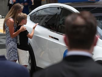 CAPE CANAVERAL, FLORIDA - MAY 27: NASA astronaut Karen Nyberg and her son Jack say goodbye to husband and dad NASA astronaut Doug Hurley after he got into a Tesla vehicle after walking out of the Operations and Checkout Building on their way to the SpaceX Falcon 9 rocket with the Crew Dragon spacecraft on launch pad 39A at the Kennedy Space Center on May 27, 2020 in Cape Canaveral, Florida. The inaugural flight will be the first manned mission since the end of the Space Shuttle program in 2011 to be launched into space from the United States.  (Photo by Joe Raedle/Getty Images)