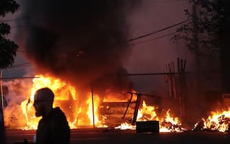 MINNEAPOLIS, MINNESOTA - MAY 29: Vehicles burn during a protest sparked by the death of George Floyd while he was in police custody on May 29, 2020 in Minneapolis, Minnesota. Earlier today, former Minneapolis police officer Derek Chauvin was taken into custody for Floyd's death. Chauvin has been accused of kneeling on Floyd's neck as he pleaded with him about not being able to breathe. Floyd was pronounced dead a short while later. Chauvin and 3 other officers, who were involved in the arrest, were fired from the police department after a video of the arrest was circulated.   Scott Olson/Getty Images/AFP
== FOR NEWSPAPERS, INTERNET, TELCOS & TELEVISION USE ONLY ==