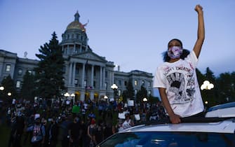 DENVER, CO - MAY 29: A woman joins in a protest near the Colorado state capitol during a protest on May 29, 2020 in Denver, Colorado. This was the second day of protests in Denver, with more demonstrations planned for the weekend. Demonstrations are being held across the US after George Floyd died in police custody on May 25th in Minneapolis, Minnesota.  Michael Ciaglo/Getty Images/AFP
== FOR NEWSPAPERS, INTERNET, TELCOS & TELEVISION USE ONLY ==