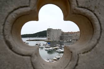 This picture taken on May 17, 2020, shows a port in the old town of the city of Dubrovnik, on the Adriatic coast of Croatia. - Less than two months after detecting its first infection, Montenegro is the first country in Europe to declare itself coronavirus-free, a success story the tiny country hopes will lure tourists to its dazzling Adriatic coast this summer. Tourism operators have already seized the opportunity to brand Montenegro as "Europe's First COVID-19 Free Country" in videos promoting its stunning natural beauty, with beaches snaking along the south and rugged mountains in the north. Up the coast, tourism powerhouse Croatia is also hoping to capitalise on its relatively low virus numbers to salvage the 2020 season. (Photo by DENIS LOVROVIC / AFP) (Photo by DENIS LOVROVIC/AFP via Getty Images)