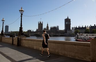 LONDON, ENGLAND - MAY 29: A jogger walks along Southbank by the River Thames on May 29, 2020 in London. The British government continues to ease the coronavirus lockdown by announcing schools will open to reception year pupils plus years one and six from June 1st. Open-air markets and car showrooms can also open from the same date.  (Photo by Jo Hale/Getty Images)