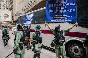 HONG KONG, CHINA - MAY 27: Riot police stand guard during a protest against a planned national security law at Admiralty district on May 27, 2020 in Hong Kong, China. Chinese Premier Li Keqiang said on Friday during the National People's Congress that Beijing would establish a sound legal system and enforcement mechanism for safeguarding national security in Hong Kong.(Photo by Billy H.C. Kwok/Getty Images)