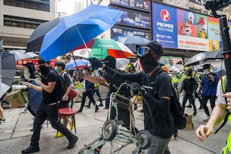 HONG KONG, CHINA - MAY 27: Hong Kong protesters rally against China's national security law at Mongkok district on May 27, 2020 in Hong Kong, China. Chinese Premier Li Keqiang said on Friday during the National People's Congress that Beijing would establish a sound legal system and enforcement mechanism for safeguarding national security in Hong Kong.(Photo by Billy H.C. Kwok/Getty Images)