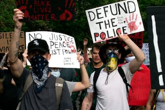 Demonstrators march in Denver, Colorado on May 31, 2020, to protest the death of George Floyd, an unarmed black man who died while while being arrested and pinned to the ground by the knee of a Minneapolis police officer. - Thousands of National Guard troops patrolled major US cities  after five consecutive nights of protests over racism and police brutality that boiled over into arson and looting, sending shock waves through the country. The death Monday of an unarmed black man, George Floyd, at the hands of police in Minneapolis ignited this latest wave of outrage in the US over law enforcement's repeated use of lethal force against African Americans -- this one like others before captured on cellphone video. (Photo by Jason Connolly / AFP) (Photo by JASON CONNOLLY/AFP via Getty Images)