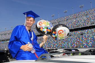 DAYTONA BEACH, FLORIDA - MAY 31:  Graduates of Matanzas High School receive their diplomas on the track in their cars at Daytona International Speedway on May 31, 2020 in Daytona Beach, Florida. (Photo by Sam Greenwood/Getty Images)