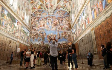 VATICAN CITY, VATICAN - JUNE 01: (EDITORIAL NEWS  USE ONLY – STRICTLY NO COMMERCIAL OR MERCHANDISING USAGE) Vistors view the Sistine Chapel frescoes at the Vatican Museums on June 01, 2020 in Vatican City, Vatican. The Vatican Museums reopened today to the public, while following the safety guidelines prescribed by Italian and Vatican health officials. They will be accessible only by reservation. (Photo by Franco Origlia/Getty Images)