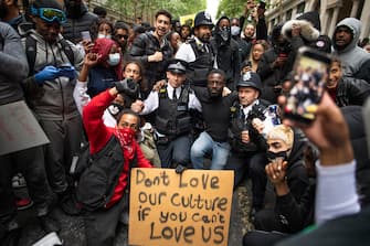 LONDON, ENGLAND - JUNE 03: Protesters and police come together during a Black Lives Matter protest on June 03, 2020 in London, England.  The death of an African-American man, George Floyd, while in the custody of Minneapolis police has sparked protests across the United States, as well as demonstrations of solidarity in many countries around the world. (Photo by Justin Setterfield/Getty Images)