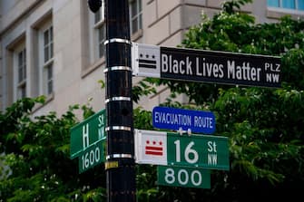 A new street sign that reads "Black Lives Matter Plaza NW" can be seen at the intersection of H and 16th Street near the White House in Washington DC, on June 5, 2020. - Washington mayor Muriel Bowser on June 5 renamed an area near the White House that has become the epicenter of anti-racism protests over the past week "Black Lives Matter Plaza" -- unveiling a giant street mural. (Photo by ROBERTO SCHMIDT / AFP) (Photo by ROBERTO SCHMIDT/AFP via Getty Images)