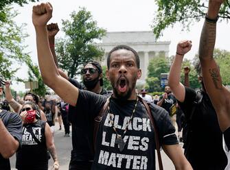 WASHINGTON, DC  - JUNE 06: Demonstrators march away from the Lincoln Memorial during a protest against police brutality and racism takes place on June 6, 2020 in Washington, DC. This is the 12th day of protests with thousands of people descending on the city to peacefully demonstrate in the wake of the death of George Floyd, a black man who was killed in police custody in Minneapolis on May 25. (Photo by Drew Angerer/Getty Images)