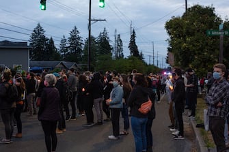 TACOMA, WA - JUNE 03: People listen during a vigil for Manuel Ellis, a black man whose March death while in Tacoma Police custody was recently found to be a homicide, according to the Pierce County Medical Examiners Office, near the site of his death on June 3, 2020 in Tacoma, Washington. Protests and other events sparked by the death of George Floyd have continued in the Tacoma area after the Medical Examiner found that the cause of death in the Manuel Ellis case was caused by respiratory arrest due to hypoxia due to physical restraint. (Photo by David Ryder/Getty Images)