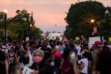 WASHINGTON, DC - JUNE 06: Protesters gather along the recently rename Black Lives Matter Plaza near the White House as the sun sets during continued demonstrations on June 6, 2020 in Washington, DC. This is the 12th day of protests since George Floyd died in Minneapolis police custody on May 25. (Photo by Samuel Corum/Getty Images)