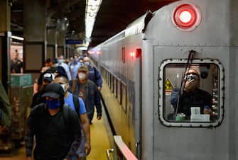 Commuters arrive at Grand Central Station with Metro-North during morning rush hour on June 8, 2020 in New York City. - Today New York City enters "Phase 1" of a four-part reopening plan after spending more than two months under lockdown. New York City is the final region in the state to reopen its economy. (Photo by Angela Weiss / AFP) (Photo by ANGELA WEISS/AFP via Getty Images)