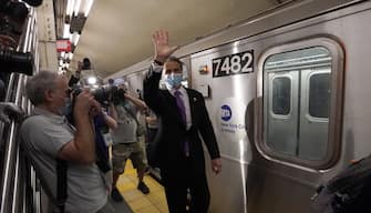 New York Governor Andrew Cuomo waves after riding the New York City subway 7 train into the city on June 8, 2020 in New York. - Today New York City enters "Phase 1" of a four-part reopening plan after spending more than two months under lockdown. New York City is the final region in the state to reopen its economy. (Photo by TIMOTHY A. CLARY / AFP) (Photo by TIMOTHY A. CLARY/AFP via Getty Images)